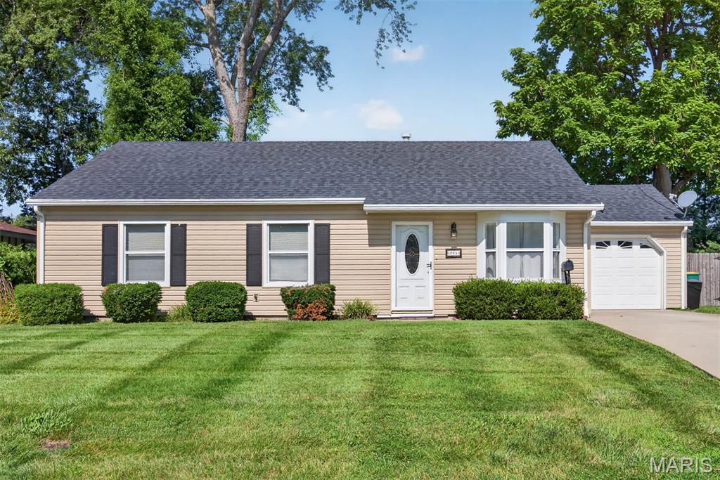 Welcome home to this very well-maintained and inviting 3-bedroom, 2-bath home that offers comfort, charm, and move-in-ready convenience. The  living room, dining area, and kitchen feature beautiful wood flooring that adds warmth and character throughout the main living space. The primary suite includes a private bathroom with a 5-foot walk-in shower for added comfort and accessibility. Step outside to enjoy the large, maintenance-free deck overlooking the fenced backyard—perfect for relaxing, entertaining, or letting kids and pets play. A one-car attached garage provides additional convenience, making this cozy home an excellent choice for first-time buyers, downsizers, or anyone looking for a home that's been lovingly cared for.