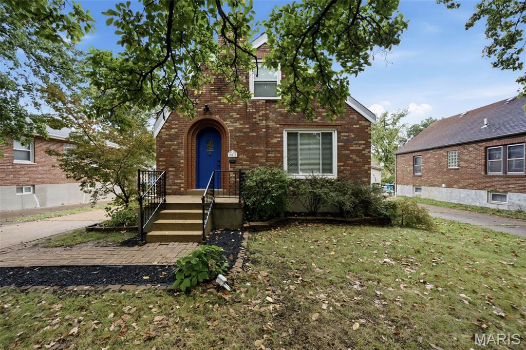 Nestled on a peaceful, tree-lined street, this classic brick bungalow blends timeless character with modern comfort. Arguably the most charming house on the block, its curb appeal shines with a signature Wedgewood blue door, intricate brick detailing, and a welcoming front porch. Step inside this light-filled 1.5-story, 3-bed, 2-bath South County gem to find handsome hardwood floors, sun-drenched rooms, and original architectural details that instantly feel like home. 

The main level features an inviting living room that flows seamlessly into a tasteful dining room, creating an effortless layout for everyday relaxation and hosting friends. Adjacent to the dining space, the updated kitchen comes equipped with bright white cabinetry, granite countertops, sleek subway tile backsplash, and modern black and stainless-steel appliances just what you need to whip up those delicious meals. Nearby, you'll find the main-floor primary bedroom alongside a dedicated home office.

From the office, stairs lead up to spacious second-level bedrooms—ideal for family, guests, or a dedicated kids' space. Downstairs, the finished lower level provides an exceptional entertainment hub, complete with a full wet bar, a second full bath, and flexible bonus space for a second office or playroom. Step outside to a fully fenced, lush backyard featuring a handy storage shed.  Combining classic charm, generous living spaces, (plus newer systems, a brand new roof scheduled for installation) and an unbeatable location—schedule your private tour today!