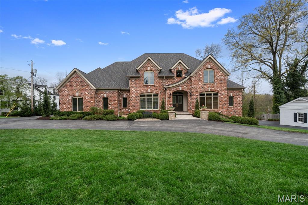 This beautiful custom home right in the heart of Ladue, has over 7000 total square feet of refined living space. Built in 2007, this expansive residence features 5 spacious bedrooms  and 5 full baths and 2 half baths. As you enter the grand two-story foyer, you are greeted by a view into the welcoming family room and flanked by an oversized dining room and an inviting office. The main level also features the primary suite that boasts two closets, a chef’s kitchen that adjoins the hearth room which opens to a deck, and a spacious laundry room. The second level features three generous en-suite bedrooms and a convenient second laundry room. The lower level elevates the home’s luxury appeal with a family room, game room, full bar, sauna, additional half bath, a 5th bedroom, and a full bath that includes a steam shower. Situated on a large, private lot with lots of off-street parking, the outdoor space is a true retreat—complete with a beautiful in-ground pool and relaxing hot tub, perfect for summer gatherings. An added bonus is the 3 car garage has a car lift. This is a rare opportunity to own a well-appointed home in one of Ladue’s most desirable locations, combining space, privacy, and resort-style amenities. All offers should be submitted by 8:00 pm Saturday 4/11/26 with a response time of Sunday 4/12/26 at 8:00 pm.