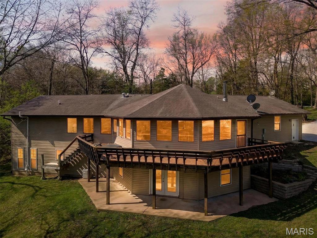 Your Private 5-Acre Escape—Where Sunsets, Pizza Nights & Garden Dreams Come to Life! 

Amazing, spacious ranch home on 5+ acres just minutes from Hwy 44 at the Pacific exit—offering the perfect blend of privacy, functionality, and convenience while keeping you close to St. Louis attractions. Inside, you’ll find custom-milled hickory floors sourced from the property and soaring cathedral ceilings. The semi-octagon Great Room features a stunning wall of windows with breathtaking views and a cozy wood-burning stove/fireplace, creating the perfect space to gather and unwind. The kitchen is open to the Great Room and features granite countertops, custom cabinetry, and a new kitchen sink—ideal for both everyday living and entertaining. The main-floor primary suite includes a newly updated bathroom suite, along with a spacious second bedroom, an additional full hall bath, and a dining area completing the main level. The spacious, finished walkout lower level offers a large family room, two additional bedrooms, and a beautifully updated full bath.

Step outside and experience a truly unique lifestyle—featuring a wrap-around deck with built-in seating, a handmade pizza oven built above the garden, and a 400 sq ft fenced garden with a stone walkway, ready for planting. Enjoy numerous edible fruit plants including peach, plum, blueberry, blackberry, and elderberry. The mostly level yard is perfect for relaxing, entertaining, wildlife watching, or simply taking in the peaceful surroundings, while the private circle driveway makes hosting easy and an expanded shed with a large firewood storage area. 

Updates include new carpet in main-level bedrooms, a remodeled primary bathroom suite, newly fenced front yard, SpringWell UV whole-house water filtration system, new water softener, new hot water heater, new garage doors, updated HVAC components, and well system improvements. Starlink internet is installed and negotiable with the sale.

A regenerative farm with a farmers market is located off the main street (Phelan). 

A rare opportunity to own a private retreat that blends comfort, sustainability, and everyday beauty.