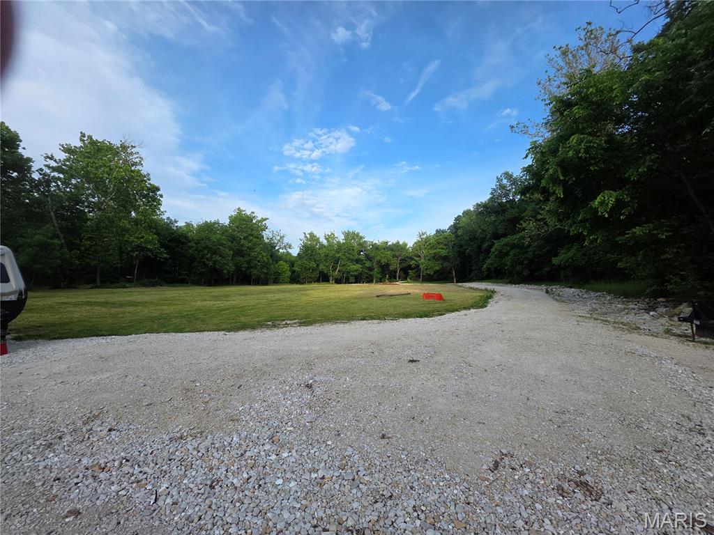 Don't miss this beautiful 5.81± acre tract just outside Troy! This property offers public water, an existing pole barn, and plenty of space to build your dream home, establish a hobby farm, or simply enjoy peaceful country living. There is currently no electric or sewer on the property, providing the flexibility to develop it to your own specifications. Conveniently located.