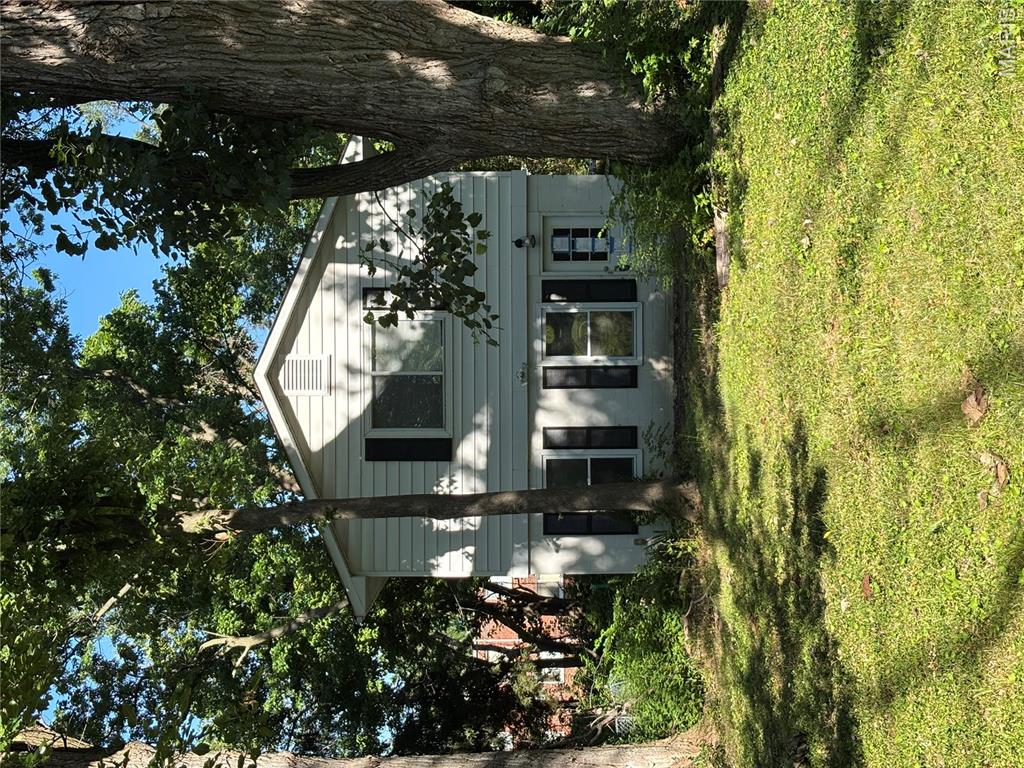 This property offers a strong chance to build equity on a beautiful wooded half-acre lot... a rare size in the area... complete with a detached garage and spacious yard. The home has no basement and will be sold strictly as-is. 
The layout features an open main-level living space that flows from the living room into the kitchen, plus a large family room that can easily serve as a third bedroom. Upstairs you’ll find two bedrooms with ample closet space and a full bathroom. While significant work is required: including a new HVAC system, full kitchen renovation, mold remediation, and addressing tree issues (including a large broken tree suspended in the canopy). 
This property is priced to reflect its current condition and presents excellent potential for a full rehabilitation or tear-down/rebuild project. Ideal for cash buyers, hard money investors, or those using FHA 203k financing. Perfect for someone ready to create long-term value on a sizable lot. Schedule your appointment today!