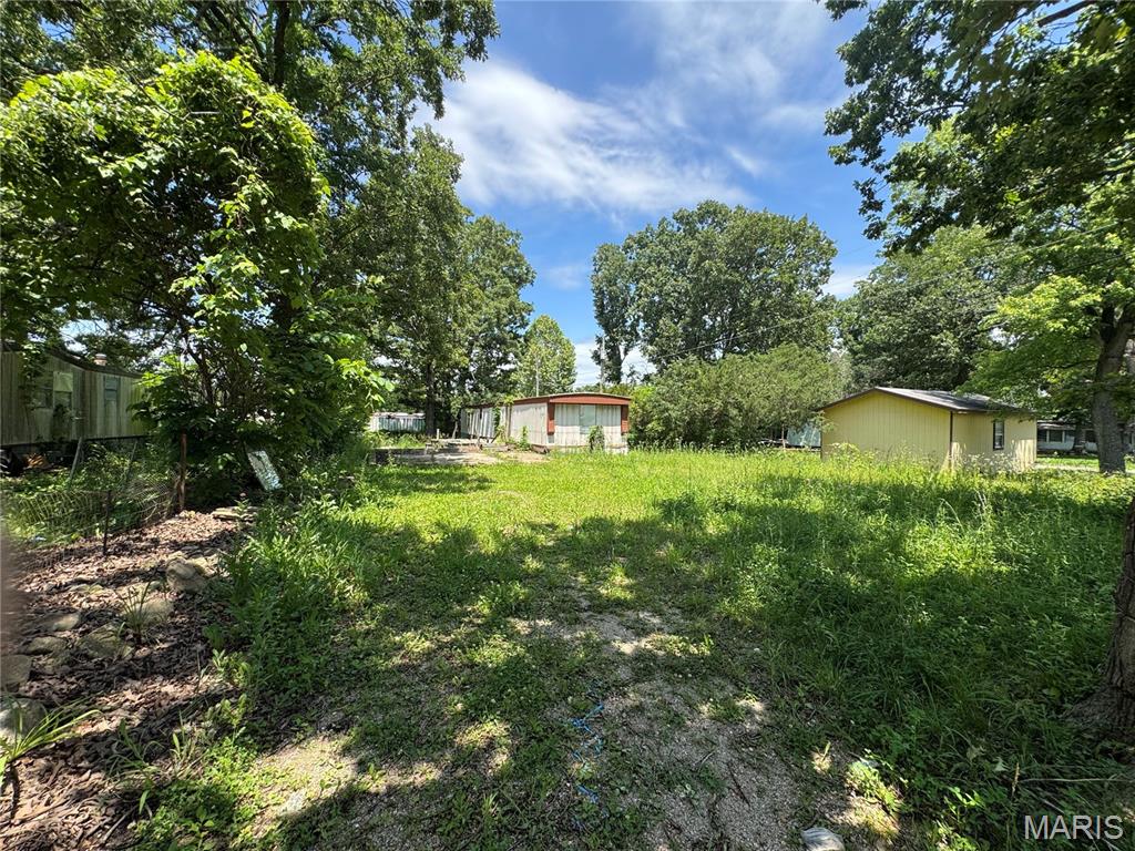 Opportunity awaits with this versatile 0.20 +/- acre residential lot featuring public water, public sewer, and electric already on the property. Mobile homes are permitted, making this an excellent option for mobile home placement or future homesite. An existing mobile home is located on the property and is being conveyed with no assigned value. Buyers & buyers agents are encouraged to perform their own due diligence regarding the condition and suitability of all improvements, utilities, zoning, lot boundaries & subdivision restrictions if any. Conveniently located in between St. Robert & Dixon Missouri and ready for your vision to take shape.