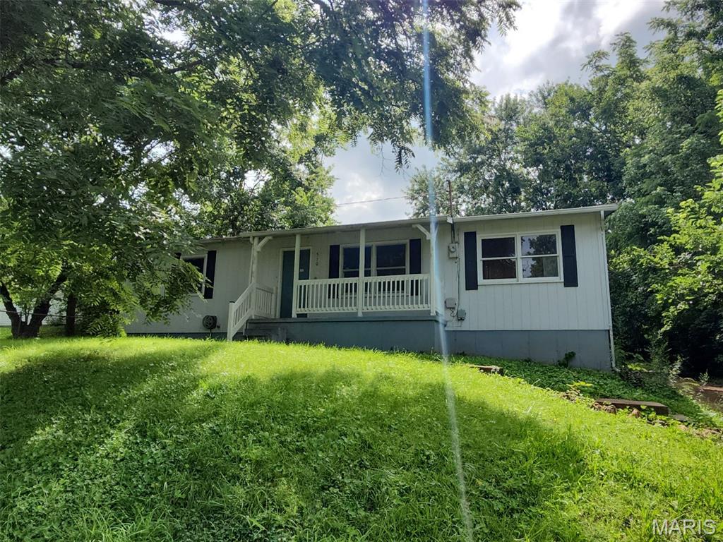 Located at 510 Marlowe St in Fredericktown, MO, this single-family home features approximately 1,189 square feet of living area with two bedrooms and one bathroom. Exterior amenities include a single-car covered carport, while the lower level offers an unfinished poured-concrete basement with eight-foot-plus ceiling heights, providing storage space and layout potential.