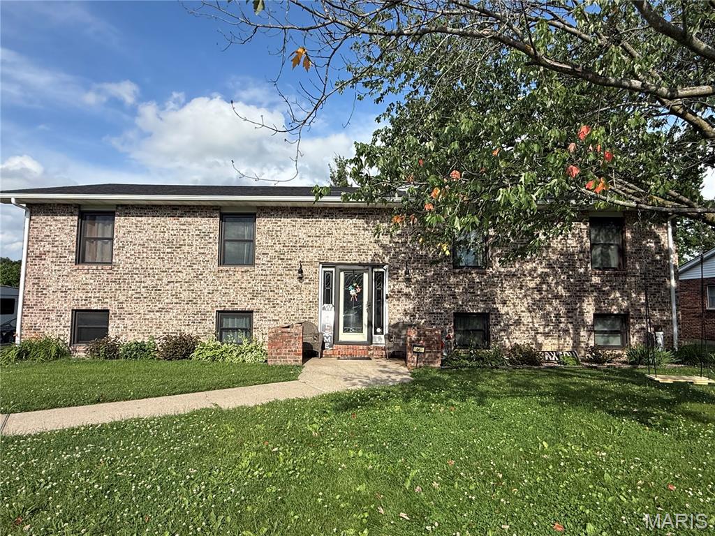 Welcome to 66 Homestead! This all-brick, split-level home has a lot of offer including 5 bedrooms and 3 bathrooms. The exterior is all brick with replacement windows and a chain-link fence. The interior features an open concept living room, dining room, and kitchen. The living room has a woodburning fireplace. The kitchen has wood cabinets, appliances convey, and a large island. Off the dining room is a deck with access to the fenced backyard. The main level has three bedrooms and two full bathrooms. The lower level has two additional bedrooms, a possible third bedroom/office, a family room, and a laundry room with third bathroom. The house has an attached garage. (Flag pole does not convey.)