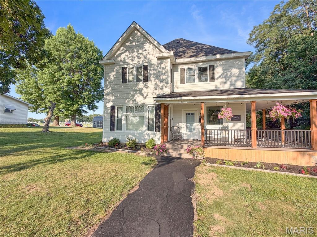 Historic Charm, Modern Updates, and Room for Everyone! Welcome to this updated 5 bedroom 2.5 bath home sitting on 1.2 acres in town! From the moment you arrive, the inviting wraparound porch sets the tone—perfect for morning coffee, evening relaxation, or entertaining friends and family. Inside, you'll find gorgeous original hardwood floors throughout the main level, refinished original pocket doors that preserve the home's historic charm, and a spacious open layout for everyday living. The kitchen offers abundant prep space with both a wall oven and range, a large island for gathering, and a cozy breakfast nook, while the formal dining room provides the perfect setting for holidays and special occasions. The main floor features one bedroom, while four generously sized bedrooms upstairs provide plenty of room for everyone. The heated and cooled 2.5-car garage offers exceptional flexibility for vehicles, hobbies, or a workshop. If you've been searching for a home with character, modern updates, spacious rooms, and incredible outdoor living space, this one truly has it all.