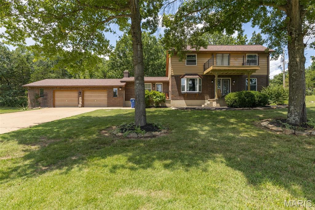 Great Home in Terre du Lac with Lots of Recent Updates! Newer Roof, HVAC, Windows, Deck and Black Metal Railings! Inside Features Bamboo Flooring in the Open Living/Dining Room Area with a Woodburning Fireplace. Kitchen comes with All Appliances and is Nice & Bright! 1/2 Bath for Guests and Main Level Laundry. Primary Bdrm on Main Level as well, with New Stand Up Shower, Jet Tub & Big Walk In Closet. Upstairs Features 2 Good Sized Bedrooms and Full Bath. The Garage is 25 X 39 Giving Plenty of Space for Cars & Toys! Super Location Right Across from Golf Course!