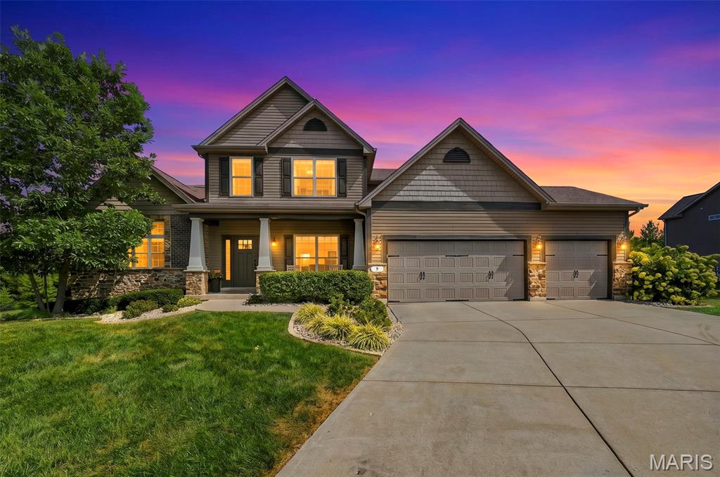 Welcome to this beautifully designed story-and-a-half home offering a spacious floor plan, quality finishes, and an abundance of natural light throughout. At the heart of the home is the impressive kitchen, featuring staggered-height and depth cabinetry, granite countertops, stainless steel appliances, double wall ovens, an oversized center island with sink and generous overhang for additional seating, plus a convenient dry bar area. A pantry with a custom closet system provides exceptional organization and storage. The kitchen flows seamlessly into the breakfast and hearth rooms, creating an inviting space for everyday living and entertaining. A triple sliding door in the breakfast room, four-window wall in the great room, and additional windows in the hearth room fill the main living areas with natural light. The hearth room is highlighted by a stone-surround direct-vent fireplace, adding warmth and character to the open living space. Hardwood flooring extends through the foyer, hall, kitchen, breakfast area, and hearth room. Additional architectural details include open stairs leading to the lower level and wrought-iron spindles. The spacious primary suite features a luxurious private bath and a custom-designed closet offering excellent organization and storage. Upstairs, you'll find generously sized secondary bedrooms, each enhanced with custom closet systems. A spacious bonus room and loft area provide excellent flexibility for a home office, playroom, media room, or additional gathering space. A true Jack-and-Jill bathroom connects two of the bedrooms, while an additional hall bath adds convenience for family and guests. Step outside to an oversized aggregate patio with a firepit, providing plenty of room for outdoor entertaining, dining, or relaxing. The private backyard creates a peaceful setting and extends the home's living and entertaining space outdoors. Dual heating and cooling systems provide enhanced comfort throughout both levels. With its thoughtful layout, custom storage, spacious rooms, quality finishes, private backyard, and multiple indoor and outdoor entertaining areas, this story-and-a-half home offers an exceptional combination of style, function, and everyday comfort.