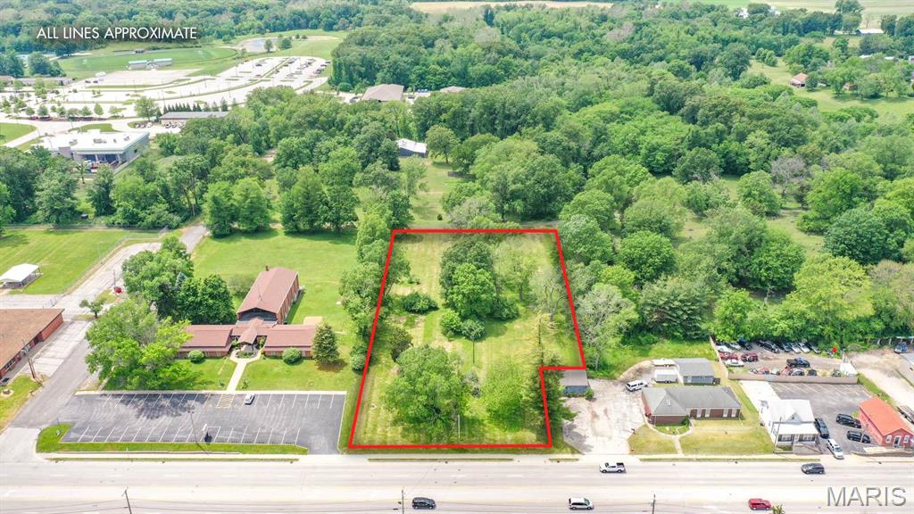 Amazing commercial property within the Enterprise Zone and Business District with the opportunity for a variety of businesses. Build to suit your needs and the needs of your customers on this 1.8 acre m/l property just moments from 255 and only 30 minutes from St. Louis. Sale includes 3 parcels, 24-2-01-23-03-301-018, 24-2-01-23-03-301-019, 24-2-01-23-03-301-020. Taxes, lot size & legal description are based on the combination of all 3 parcels. Buyer and buyers agent to verify with Village of Godfrey for appropriate zoning. Location: High Traffic, Suburban