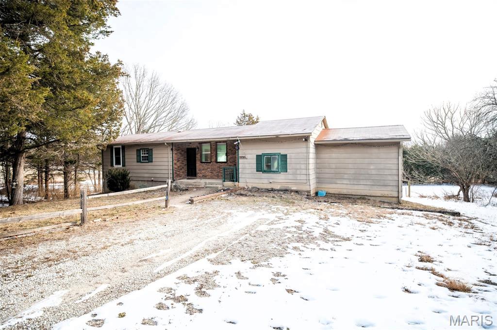 Welcome home to peaceful country living just outside the city limits with this 3-bedroom, 1-bath home situated on 1.3 (m/l) acres. The home provides a convenient layout with a spacious living area, kitchen with ample cabinet space, laundry room, and all 3 bedrooms on the main floor. Newer HVAC and water heater are a bonus! The basement provides additional space for storage or a workshop. Outside offers room for gardening, outdoor activities, pets, or simply enjoying the quiet rural setting.