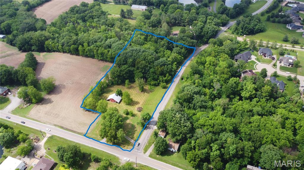 Very unique opportunity to build your dream home on 5 idyllic acres on the outskirts of town in the Edwardsville School Dist!  Just over 5 Acres on a corner lot.  Partial cleared pasture and partial wooded.  There is an existing barn on the site.  This is located at the intersection of 143 and Staunton rd, at the front door of Stonecliffe Estates.  Ease of access to town without dealing with the traffic and easy access to bike trails and I55 exit.  Land could also be subdivided into smaller lots.  Endless opportunity for a dream home or for an investment vehicle.