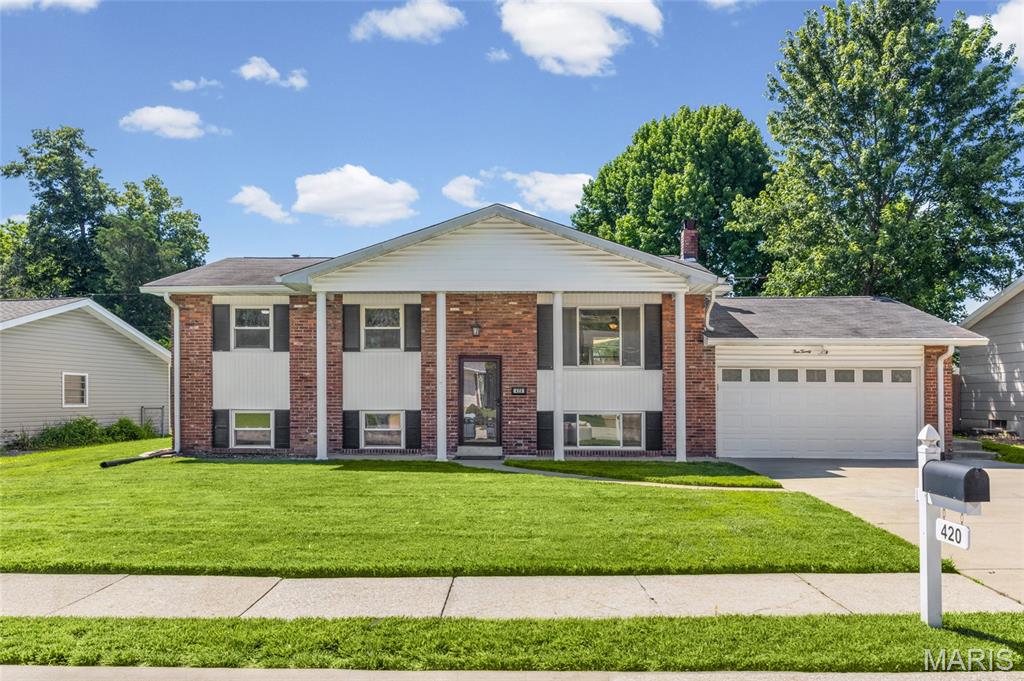 Ideally situated just minutes from Lindenwood University and all that St. Charles has to offer, this spacious split-level home combines comfort with convenience. Inside, you'll find an open concept living room/dining room combo, spacious kitchen, 3 bedrooms, and 1.5 baths on the main level. Lower-level space includes a versatile bonus room that could serve as a 4th bedroom, home office, or guest suite. The rest of the finished lower level features a warm and inviting family room anchored by a charming wood-burning fireplace, creating the perfect gathering space. With 2 full baths, a half bath, and an oversized attached 2-car garage, there's plenty of room for everyday living.  Enjoy an active lifestyle with nearby McNair Park, where you'll find playgrounds, tennis and pickleball courts, soccer and softball fields, gazebos, and countless opportunities for outdoor recreation. A fantastic opportunity in a highly desirable location!