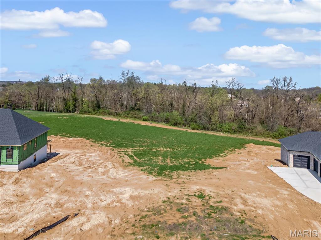 This beautiful walkout lot offers a rare opportunity in the long-awaited newest phase of Stone Cliff Subdivision — the perfect setting to design the custom home you've been picturing, built exactly the way you want it. Bring your own builder and plans, or let us connect you with a trusted recommendation to bring your vision to life. The location offers convenience without sacrificing a sense of community. You're just minutes from three major interstates for an easy commute, the new Family Sports Park for weekend game days, SIUE, and the scenic MCT Trails for hiking, biking, or simply slowing down. Add in top-rated schools nearby, and this established neighborhood — with its green space, common areas, community pavilion, and lake views — offers a setting that supports every stage of life. This is more than a lot — it's the foundation for the home you've been envisioning.

Please note: Architectural design approval requires a side-load garage. Buyer is responsible for all tap-on fees and should independently verify all information provided. Reach out today for a copy of the covenants and restrictions, or ask your favorite agent for more details.