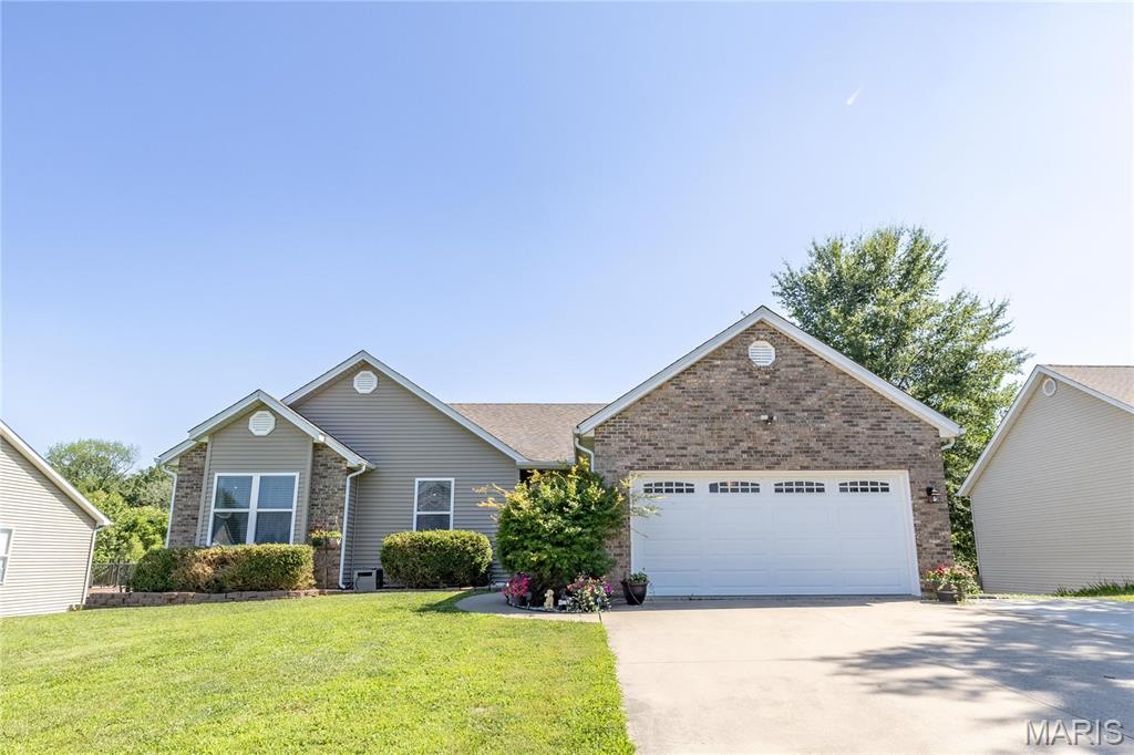 Welcome home to 206 Pleasant Lake Court, a spacious 4-bedroom, 3-bathroom home nestled in a quiet, tucked-away neighborhood with only two streets, offering privacy and a peaceful setting while remaining conveniently close to town.
Step inside and be greeted by spacious vaulted ceilings and an open, inviting layout filled with natural light. The home features updated flooring throughout the main level for a fresh feel and easy cleaning. With generous living spaces on both the main level and the finished walkout basement, there is plenty of room for entertaining, or relaxing.
The lower level expands your living options with a large recreation area and convenient walkout access to an oversized patio, while the upper level offers access to a spacious deck—perfect for enjoying morning coffee or hosting gatherings with friends and family.
Outside, you'll love the huge fenced backyard. Residents also enjoy access to a community pool! 
Combining spacious indoor living, outstanding outdoor amenities, and a serene location, this is the perfect place to call home.