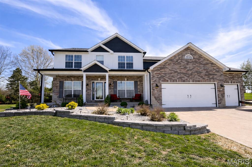 Tucked at the top of a quiet cul-de-sac in Westborough Estates, this one has been completely dialed in. Over 3,100 sq ft across two floors, 4 bedrooms, 3.5 baths & a 3-car garage with epoxy floors, 11-ft ceilings & 22-ft depth — built for the buyer who wants space to actually live. The main level flows the way it should: formal dining with coffered ceilings, a private office behind French doors, a great room anchored by a gas fireplace & built-in bookcases, a main level laundry room, and a kitchen that delivers — granite counters, stainless appliances, walk-in pantry, coffee bar & a breakfast nook that opens straight to the sunroom and screened porch. The backyard is your own park: half an acre, basketball court, fire pit, hot tub hookup & total privacy. Upstairs, the primary suite is a genuine retreat — 27x16, vaulted ceiling, walk-in closet & a spa bath with double vanity, jetted tub & separate shower. Three more oversized bedrooms & an updated hall bath complete the upper level. The basement is already fully framed & stubbed for a full bath — finish it and this becomes a 5-bedroom, 4.5-bath home. That's instant equity with a clear path. The sellers didn't cut corners on the way out either: new siding, gutters & fascia (2025), full WiFi irrigation (2024), new landscaping & retaining walls (2024), new water heater (2024), dual-zone smart HVAC, water softener (2023). New carpet & LVP throughout (2022). Troy R-III schools. This one is ready — come see it.