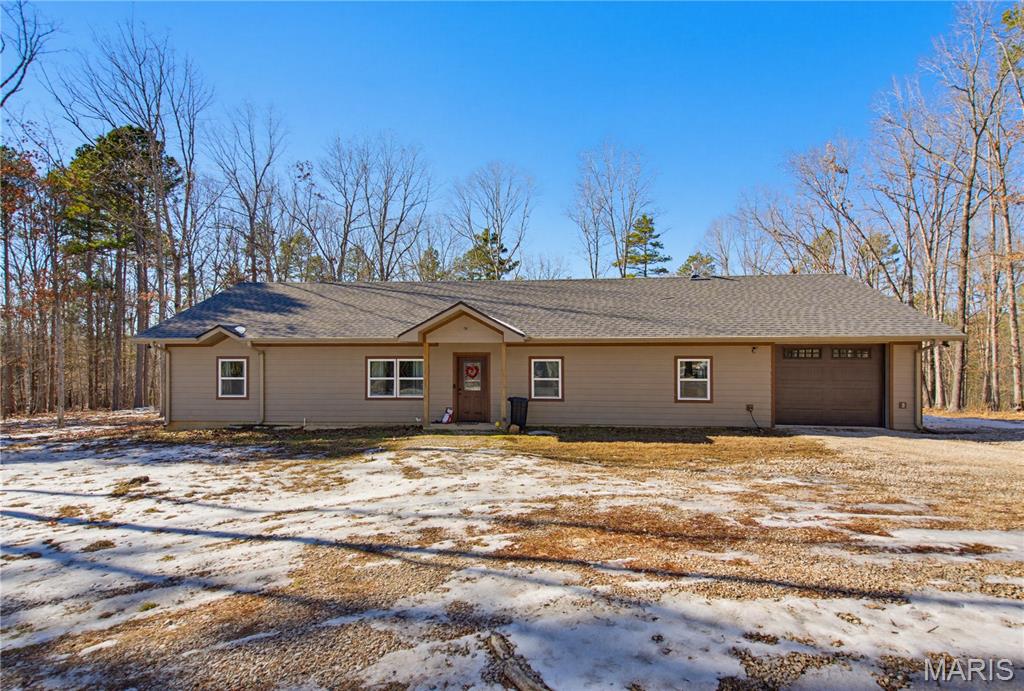 Escape to the peace and privacy of country living on 3.49 +/- acres surrounded by woods and abundant wildlife. This custom built home is only three years old and offers 3 bedrooms, 2 baths, and quality finishes throughout, including 9-foot ceilings and durable vinyl plank flooring.
The living room features a vaulted wood ceiling, great natural light, and an open flow into the dining area and kitchen. You’ll love the cabinet space, glass front accents, soft close drawers, and full appliance package with range, refrigerator, dishwasher, microhood, and air fryer oven.
The primary suite is designed for comfort with a walk in closet, double vanity, custom tile shower, and a beautiful soaking tub perfect for unwinding at the end of the day. Additional perks include a spacious laundry room with countertop workspace and a 14x28 heated and cooled garage with pull-down attic storage.
Room to roam, modern construction, and the setting buyers dream about, this one is ready to call home.