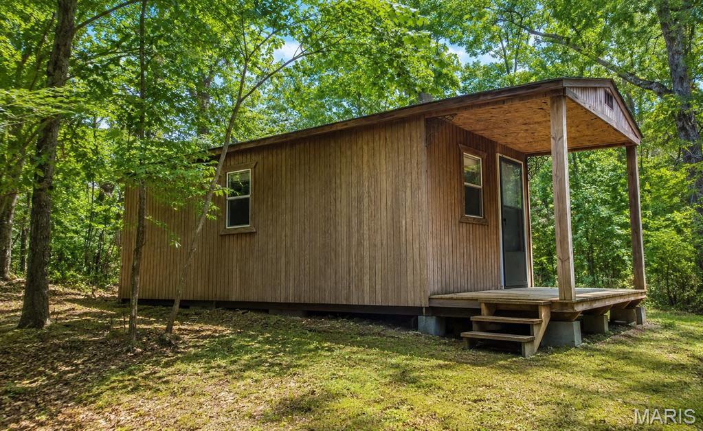 Escape to your own private wilderness! This serene 3.5-acre wooded home site offers the perfect blend of secluded tranquility and ultimate convenience, located just 30 minutes from St. Louis County. Tucked away near the end of a quiet dead-end road, the property features beautiful mature trees, gently sloping terrain, an established circle drive, and easy walking trails just waiting to be explored. There is even a charming cabin already on-site to enjoy while you plan your dream build! Nature lovers will thrive here—the rear of the property sits a mere 415 feet from the stunning Victoria Glades Conservation Area, bringing local wildlife right to your back door. This property sits within the highly desirable Hillsboro School District. Truly a rare find that must be seen in person to be fully appreciated. Pre-approval letter or proof of funds required with all offers.