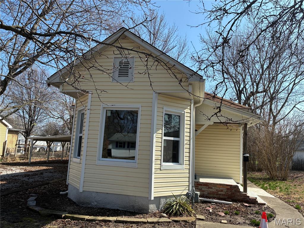 Very cute 2 bedroom house with unique rustic features throughout.  In 2026 new electric, new windows and doors, flooring, kitchen  and  a bathroom with stainglass window and a new garage door.  Large garage and huge carport. This place is ready for you just pack bags and move in.  New stainless refrigerator and stove included.  A main floor laundry and mud room completes  house.