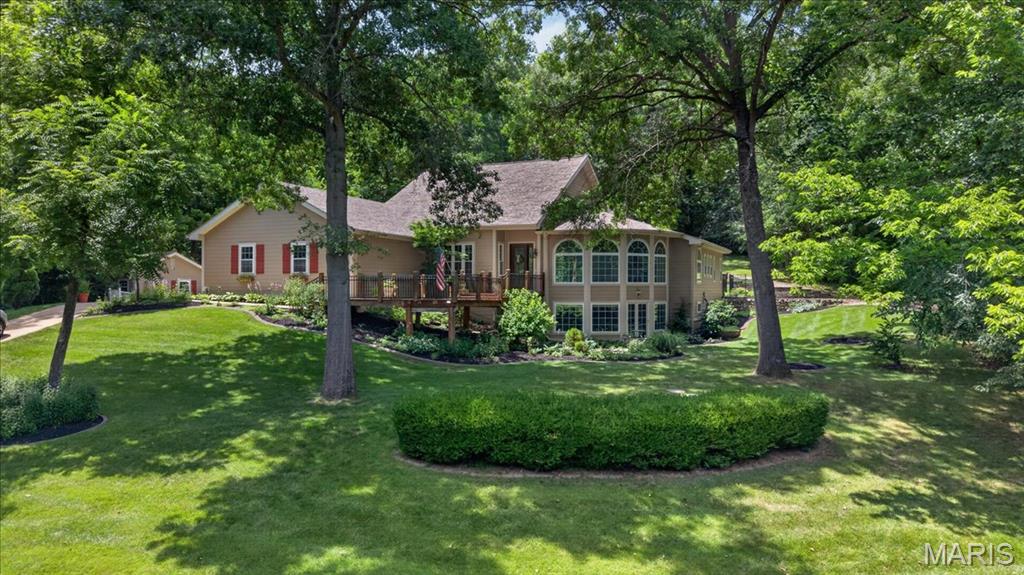 Welcome to your own private retreat on 3.01 acres in unincorporated O'Fallon. From the dramatic arched windows and soaring ceilings to the beautifully renovated kitchen with a hidden walk-in pantry, every space in this home was thoughtfully designed to be enjoyed. Even your furry family members are spoiled here, with their own dedicated dog washing station complete with retractable stairs for easy access. The spacious main-floor primary suite is a retreat of its own, offering a spa-like bathroom, oversized custom closet, and a beautiful fireplace. Whether you're hosting around the saltwater pool, gathering in the loft game room with bar and pool table, or enjoying movie night in the theater room, this home was built for entertaining. Recent updates include James Hardie siding and a newer roof. Outside, you'll find beautiful landscaping, mature trees, a waterfall feature, oversized 3-car garage, detached shed/garage, and a massive climate controled 1,500+ sqft RV / Boat Garage with workshop area. Privacy, space, and endless possibilities - all just minutes from town!