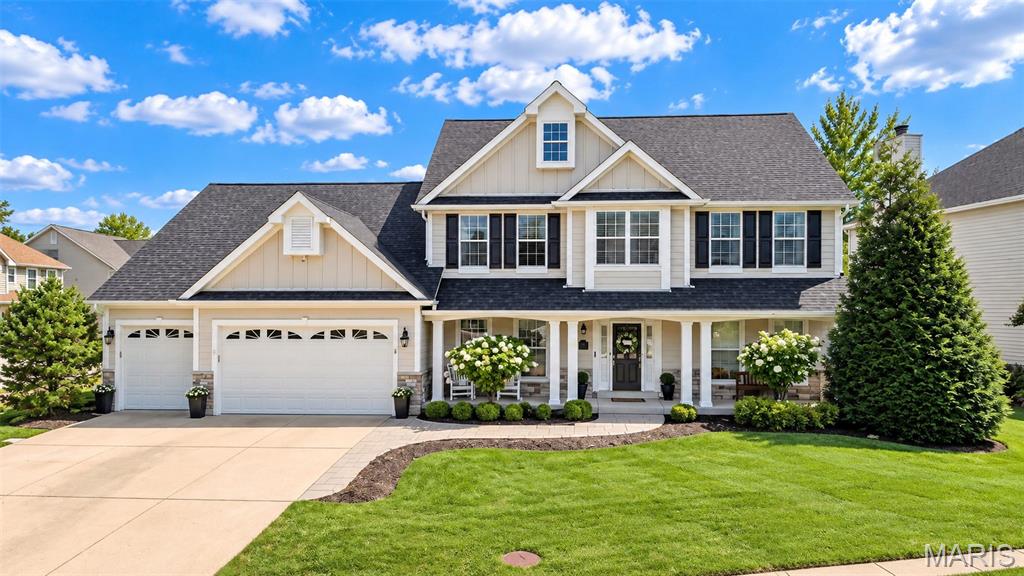 Some homes simply have it all—and this gorgeous 1.5-story Wildwood home is a standout. Offering approximately 3,500 square feet of beautifully finished living space, this thoughtfully designed home combines timeless style, quality craftsmanship, and exceptional indoor and outdoor living. New luxury vinyl plank flooring runs throughout most of the main level, creating a fresh, sophisticated look while offering easy everyday living. The welcoming main level features a spacious dining room, perfect for holiday gatherings and entertaining, along with a huge family room showcasing a gas fireplace, beautiful built-in bookcases, plantation shutters, and plenty of room for everyone to relax. The renovated kitchen is both stylish and functional, featuring refreshed cabinetry, new hardware, a large center island with seating for four, granite countertops, tile backsplash, pot filler, gas cooktop, stainless steel appliances, and new light fixtures. The open layout makes this a natural gathering space for everyday living and entertaining. The main-level primary suite is a true retreat. The spacious bedroom features new carpet, plantation shutters and a stunning updated bath with Italian Carrara marble flooring and shower, dual sinks, custom vanity, illuminated mirror, and heated floors. The amazing walk-in closet offers custom cabinetry and above-cabinet lighting. Upstairs, three spacious bedrooms provide plenty of room for family and guests. One bedroom features its own private ensuite bath, while the other two bedrooms share a convenient Jack-and-Jill bathroom. The exterior is just as impressive, with custom stonework, James Hardie siding, and a private backyard designed for relaxing and entertaining. Enjoy the expansive covered and vaulted outdoor living area, plus a side patio with an eight-person Bullfrog hot tub. The fully fenced, level backyard offers plenty of space to play, entertain, or simply unwind. A sprinkler system helps keep the landscaping looking its best. Additional highlights include a whole-house surge protector, exterior security cameras, three-car garage, and a dedicated workshop area with a convenient bump-out, built-in workbench, and cabinetry. Lower level is ready for a buyer's finishes and offers a rough-in for a bathroom. New roof in 2024. Nicely updated and exceptionally well-appointed, this Wildwood home offers the perfect combination of comfortable everyday living, impressive entertaining spaces, and thoughtful upgrades throughout.