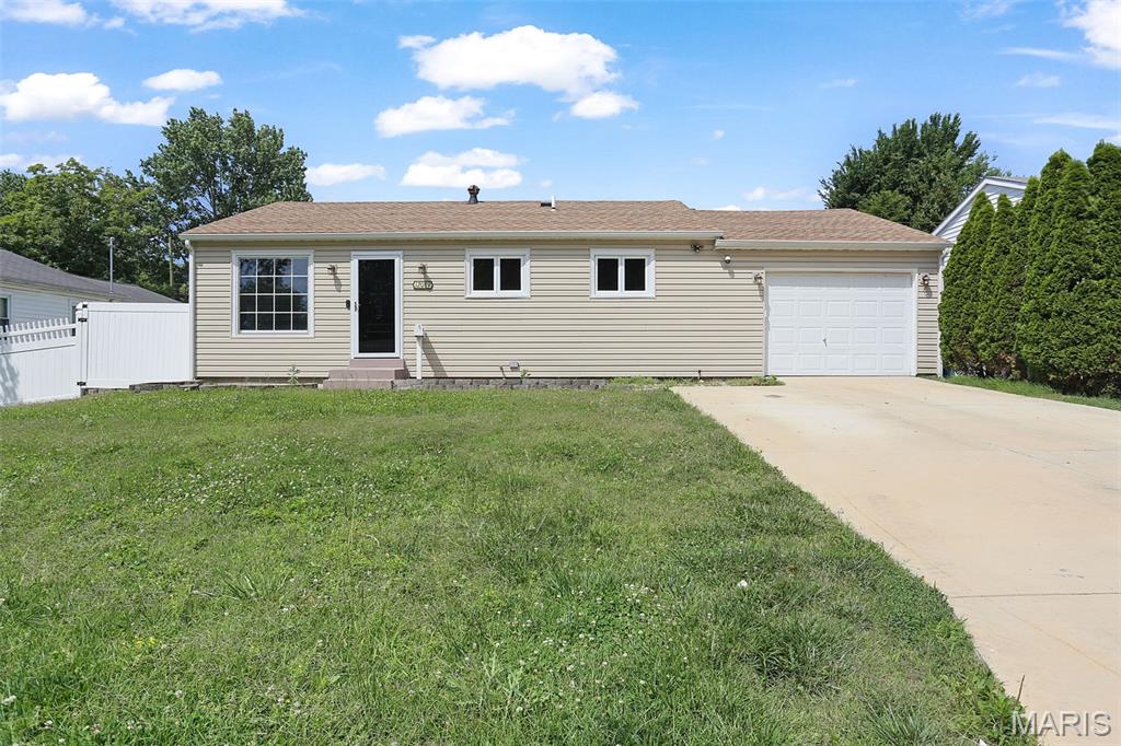 Welcome home to this charming 3-bedroom, 1-bath ranch nestled on an exceptionally quiet street in one of Maryland Heights' most desirable neighborhoods. Offering 1,148 square feet of comfortable living space on the main level alone, this home has been well cared for and features numerous major updates, including newer roof, siding, windows, HVAC, and updated electrical service. The inviting living room showcases professionally installed built-in bookshelves, adding both character and functionality. Downstairs, the partially finished basement provides valuable additional living, recreation, or workspace options. Outside, you'll find a beautifully landscaped and remarkably private backyard—an ideal setting for relaxing, entertaining, or enjoying a peaceful evening at home. Car enthusiasts, hobbyists, and those needing extra storage will appreciate the unique single-wide, double-deep garage with ample room for vehicles, projects, and equipment. While a few minor repairs and cosmetic touches could make it truly shine, this home is extremely close to move-in ready and offers an outstanding opportunity to own in a sought-after location with strong long-term value. Home is being sold as-is