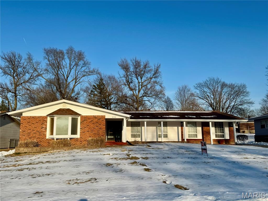 Spacious 4-bedroom, 2.5-bath home set on a generous 0.34-acre lot. Enter through the large covered front patio and step into a sun-filled living room with oversized windows that bring in abundant natural light. The home features granite countertops, hardwood floors, and a functional layout offering both comfort and flexibility. The partially finished basement adds extra living space with a cozy fireplace and wet bar, perfect for entertaining or relaxing. A 2-car garage provides ample storage and parking. Basement square footage is not included in the listed total. Open House Saturday 2/7 11am-2pm. Home is being sold in as-is condition.