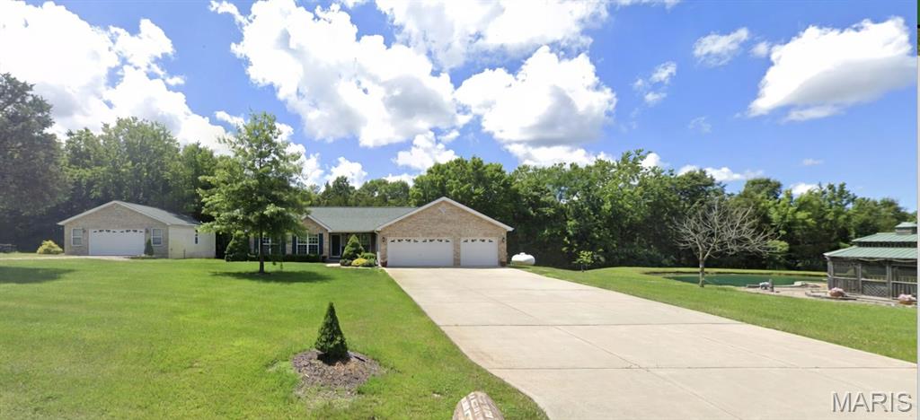 Awesome set up for this spacious ranch w/3 car garage and finished, walk out lower level on 3 acres w/pond and 4 car tandem detached garage! Home and property needs extensive work and updating, and is price reflective of needed work including pond and septic. Great opportunity to build equity.