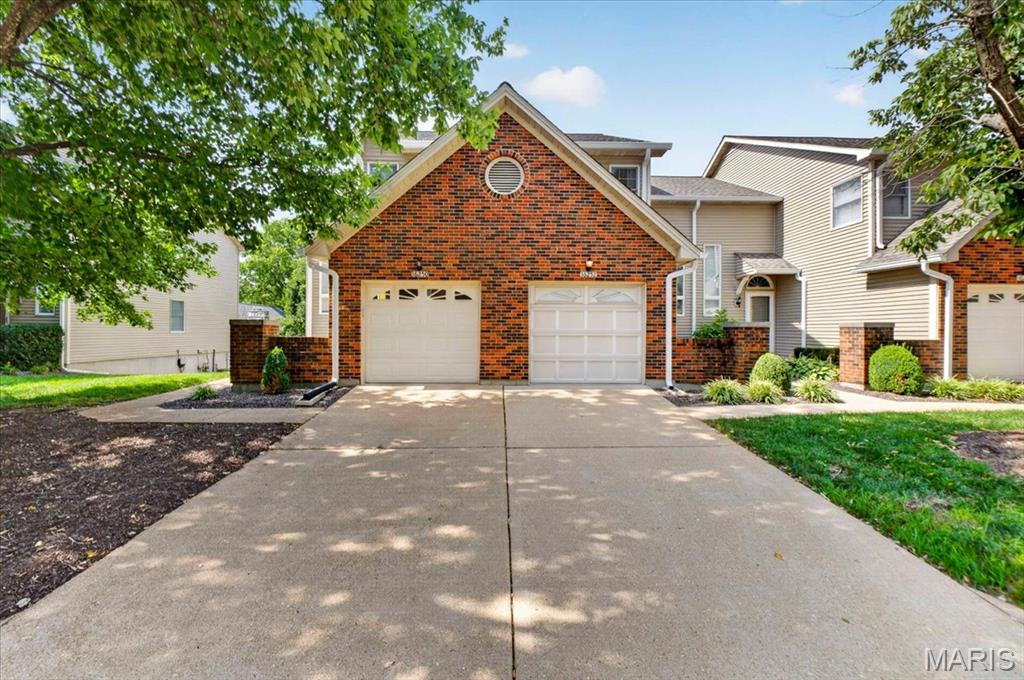 Sophisticated Interior defines this "Exceptional" Home offering 0ver 1890 Square Foot of upgrades, plus located in the "Heart of Chesterfield". This Gorgeous home is "Extra- Ordinary" offering the opportunity to own a home that is walking distance to Stores & Shopping!!  This upgraded home offers a Courtyard that leads you to the glass front door into the large Two-Story entry foyer overlooking the great room and is anchored by the gas fireplace, flanked by windows capturing views of the expansive deck and private landscaped yard! This home is designed for everyday living & effortless entertaining for friends & family! The updated Designer Kitchen features White Cabinets, granite countertops, backsplash with Premium Appliances, plus a new Stainless Refrigerator and overlooks the Light- filled Breakfast Room which creates an inviting gathering space! The Luxury Primary Suite highlights a private retreat with its vaulted ceiling and large windows plus a nice size luxury bath! Completing the upstairs is another large bedroom plus full bath. The open staircase off the Great Room leads you into the walkout lower level with large patio, plus a 20-foot family room with half bath! Additional features include a nice size garage with cabinets for additional storage and Main floor laundry w/ Washer & Dryer. Upgraded features include a Newer Roof, Gutters, Siding and Pull-down steps for attic storage. Enjoy Low Maintenance Living in " Desirable Chesterfield" with walking distance to the pool, stores, entertainment and the "New Downtown Chesterfield" Coming Soon!! This home is freshly painted and ready to move in!!! This home offers lower Condo Fees