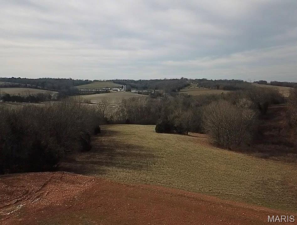 This 14+ acre property offers a serene rural setting just minutes from Highway 44 and Washington, MO. It features excellent, level hilltop views and building potential overlooking a prime lake site. This property is perfect for a private estate, a hobby farm, or small agricultural use. It is located within the R-3 (Meramec Valley-Pacific) School District. Electric service is available at the state road, and a new concrete entrance has been installed for easy access. The legal description includes Lots 1,2,3 of Ridgewood Place, Horses Welcome.