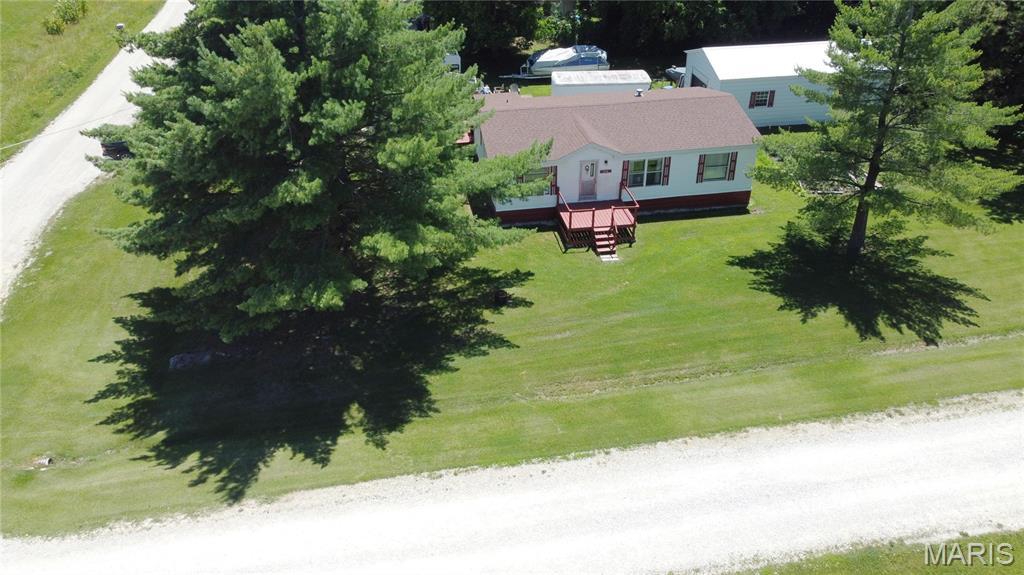 Looking for space, functionality, and value? This well-maintained 3-bedroom, 2-bath home offers comfortable living on a beautifully groomed ½-acre lot with outstanding curb appeal. Inside, you'll find a spacious and inviting layout that provides plenty of room for family, guests, or a home office.

One of the property's standout features is the large workshop, offering endless possibilities for hobbyists, craftsmen, small business owners, or anyone needing additional workspace and storage. An additional garage provides even more room for vehicles, equipment, or recreational toys.

Outside, the attractive lot features a small garden area, mature landscaping, and plenty of room to enjoy outdoor living. Whether you're looking for a place to work on projects, entertain friends, or simply enjoy a peaceful setting, this property checks all the boxes.

Affordable homes with this much living space, storage, and utility are becoming increasingly difficult to find. Don't miss your opportunity to own a move-in ready property that offers exceptional value in today's market.