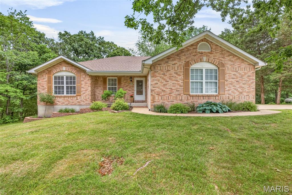 Beautiful 3-bedroom, 2-bath home situated on over 1 acre in the sought-after Hillsboro School District! Excellent location just minutes from schools, shopping, and major highways. Homes in this subdivision rarely become available. The open floor plan features a vaulted great room with a bay window, creating a bright and inviting living space. The kitchen offers hardwood flooring, breakfast bar, pantry, and all appliances stay, including the refrigerator. The adjoining breakfast room has glass doors leading to a deck overlooking the park-like backyard. The spacious primary suite includes a large walk-in closet and a spa-like bath. A stackable washer and dryer have been added for convenient main-floor laundry. The unfinished walkout lower level offers endless possibilities and includes a rough-in for a future bath, an additional washer and dryer (included), water softener, and plenty of storage space. This home has been meticulously maintained and truly checks all the boxes. Finished side-entry garage. Easy to show!