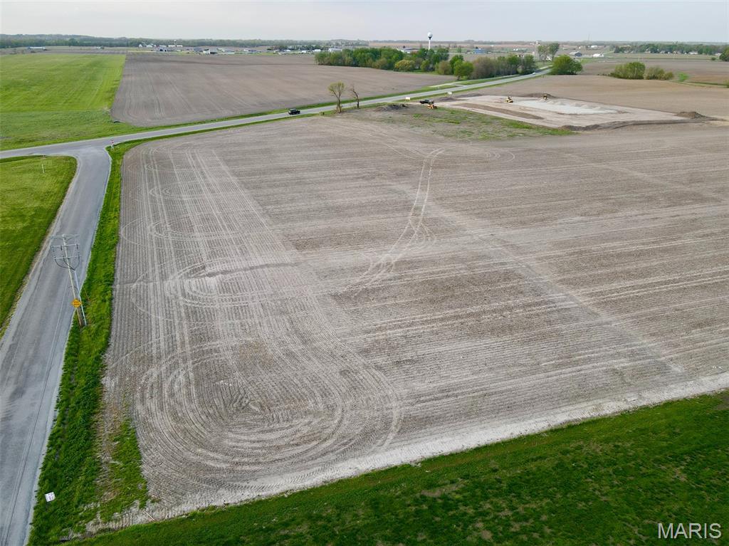 Position your business for success with this 6± acre commercial tract located just southeast of Highland, Illinois, only one mile from Interstate 70 and approximately 30 minutes from downtown St. Louis. This property is ideally suited for development, offering industrial zoning approval and outstanding visibility along Highway 40.

With strong daily traffic counts and a newly approved commercial entrance by the Illinois Department of Transportation (IDOT) currently being installed, this site is ready to support a wide range of business opportunities. Whether you're looking to start a new venture or expand an existing operation, this location delivers convenience, access, and exposure.