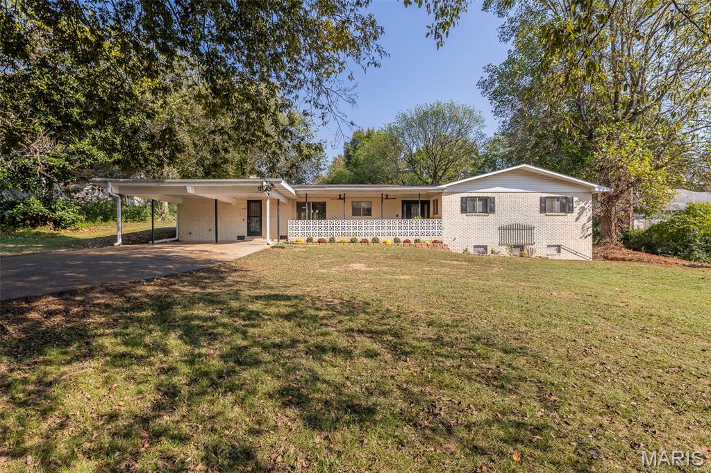 This once was probably one of Doniphan's nicest homes. It has now been restored to make it again a gorgeous, classy ranch style brick home with a partial basement with walkout. FIVE bedrooms and THREE baths. Very stylish design features huge living room with brick fireplace accented nicely by the new mantel and shelving. Comfortable dining space (with built in cabinet and coffee bar area) and totally remodeled kitchen. All new stainless 36" electric oven/range, dishwasher, side by side fridge, over the range microwave. New stylish sink and faucet. 3 beds and two full baths on main floor. Main bedroom is large and has a nice remodeled bath and a new patio just outside the sliding glass doors. Downstairs features two large new bedrooms and another full bath that has also been updated. New flooring and paint throughout the majority of the home. Large, cozy patio area in the back. Updated landscaping gives it a great new curb appeal. This home is near the heart of Doniphan and only minutes from public access to beautiful Current River. Compare the price per square foot of living space (just under $99) with any other home. You will be hard pressed to find a nicer home with all of these recent updates. And if you're looking for a comfortable 5 bedroom home, look twice at this one! Hurry and you can have fun decorating your new showplace for Christmas!! (Owned by listing agent.)