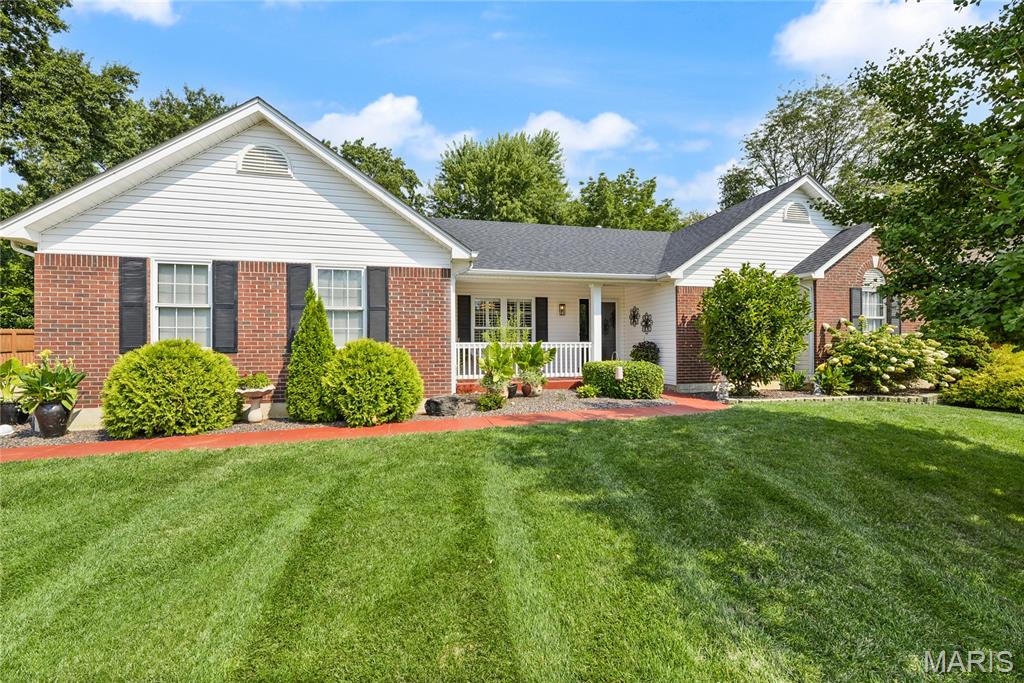 Discover an attractive single-family residence in great condition at 38 Fawn Valley CIR, STPTRS MO 63376. Built in 1994, this ranch-style home offers a harmonious blend of comfort and practical living, designed for those who appreciate a well-maintained property. The heart of this home is its open-plan kitchen, seamlessly connecting to the living room. Featuring matching black appliances and a convenient peninsula, this space is ideal for both everyday meals and entertaining. Adjacent, the living room provides a welcoming atmosphere, centered around a cozy fireplace. Retreat to one of the three comfortable bedrooms. The bathrooms offer thoughtful design, with one featuring a large double vanity and a walk-in shower, providing a spa-like experience. Beyond the interior, the property extends its appeal outdoors with a private yard, perfect for relaxation or gatherings and for the golfers a putting green. Enjoy outdoor dining on the patio or unwind on the porch. For hobbies and projects, a dedicated workshop provides an excellent space, complemented by an attached garage for convenience. This property presents a remarkable opportunity for a refined lifestyle; schedule your viewing today to experience its unique charm.