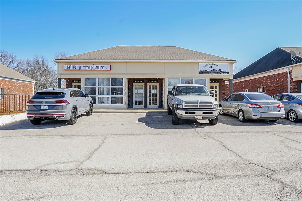 This well-maintained commercial building in Spanish Lake offers a strong investment opportunity with three fully leased units totaling 5,000 sq ft of versatile commercial space. The current tenant mix includes an autism nonprofit, a hair salon, and a religious media organization, providing a diverse and stable income stream from day one.

The building features two 1,250 sq ft units positioned on the right and left sides of the building, and a larger 2,500 sq ft unit at the rear — each with their own private kitchen or kitchen area, restrooms, and layouts that have proven attractive to a variety of tenants. Parking is available in both the front and rear of the building, offering convenient access for tenants and their clients alike.

With all three units currently under two-year leases, this property generates reliable monthly income and is an ideal addition to any real estate portfolio.

Property is being sold as-is, with seller to do no inspections or repairs.

Showings only with an accepted contract. For a preview of the interior please view virtual 360 tours below:

12412: https://my.360tourlink.com/2a02de1e-eaf9-401d-a943-69529c110b62?type=unbranded

12414: https://my.360tourlink.com/c4be0a77-430b-4425-8f29-2cf444b52e3c?type=unbranded

12424: https://my.360tourlink.com/a5658e6b-a86f-49cf-938c-5e3a5b33cad1?type=unbranded