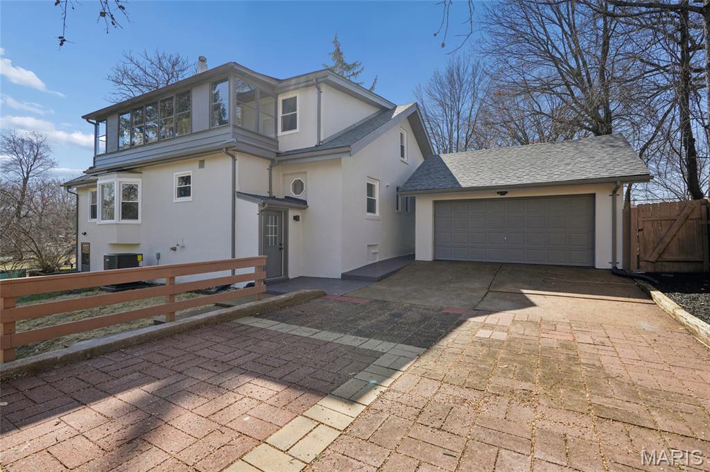A truly unique completely renovated home for comfort, flexibility & connection to nature. With 5 beds & 3.5 baths, this property features 4280 sq. ft of living area, 4 walkouts, including main floor bed with its outdoor access & another upper-level bed with a private balcony overlooking a beautiful above .5-acre park side lot. 
The finished walk out LL features a huge rec room- perfect for a media room, home gym, playroom, or mother-in-law quarters, and a full bath.
One-of-a-kind lot offers exceptional functionality & outdoor enjoyment. A rare drive-through garage opens to an additional parking area that can accommodate up to four more vehicles- perfect for guests, hobbies, or equipment. The yard features a patio, cozy firepit, shed, & plenty of space to design your outdoor kitchen, raised garden beds, or even add a pool.
Everything has been updated- new systems, roof, windows, doors, floors, kitchen, baths, light fixtures- so you can move in with confidence. The main floor laundry adds everyday convenience.
Truly exceptional combination of modern updates, flexible layout & natural beauty!