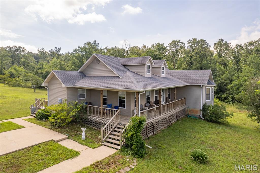 Check out this beautiful home on 12.5 +/- acres outside of Doniphan, MO!! This larger home is perfect for the growing family with newer flooring, granite countertops, and other recent updates!! The large open basement is perfect for storage or easy expansion of more bedrooms and living space! This home has been well maintained and features a beautiful piece of property offering seclusion which would be perfect for a nice homestead or just away from the hustle and bustle. The property includes a spring in front of the house that is active most of the wet seasons of the year.