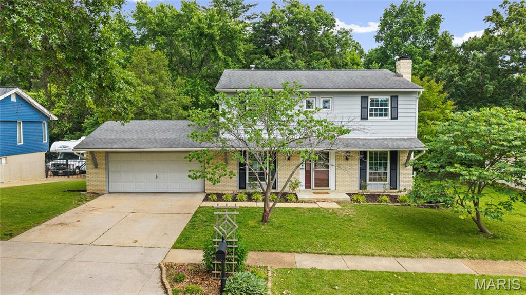 Open House 5/31 12-2pm * Don't miss this beautifully updated 4-bedroom, 2.5-bathroom home for sale in South County St. Louis nestled in the highly sought-after Towne South Estates community within the top-rated Mehlville School District. Tree-lined streets set the stage for this move-in ready home. 
Step through the welcoming entrance foyer and immediately feel at home. The spacious great room impresses with rich LVP flooring and a cozy wood-burning fireplace, perfect for relaxing evenings. A separate living room offers the ideal flex space for a home office, playroom, or formal sitting area. The dining room flows seamlessly off the kitchen, making entertaining effortless. The updated kitchen is a true showstopper, featuring white custom cabinetry with glass fronts, gleaming granite countertops, a breakfast bar, stainless steel appliances, a stylish backsplash, soaker sink, bay window, and additional cabinetry for extra storage. Main level conveniences include a dedicated laundry room and a half bath. Upstairs, the primary en suite offers a private bath retreat, while three additional spacious bedrooms with ample closet space share a beautifully updated full bath. The partially finished walk-out basement provides valuable bonus living space with endless potential. Outside, enjoy the composite deck and patio overlooking a spacious fenced-in backyard. Conveniently located near parks and restaurants. Schedule your private showing today!