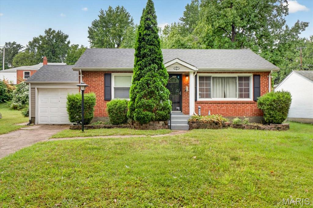 Welcome Home to 1971 Vinita Drive! Want to be in a new home for the holidays? You won’t want to miss your chance to step inside this 2 bed, 1 bath Brick Bungalow with Attached Garage! This home is centrally located between St. Charles Rock Road and Page Avenue, near all the shopping, restaurants, and amenities off Olive Blvd. Hop on Highway 70 for easy access to St. Charles and Downtown or Highway 170  to Clayton and enjoy all that St. Louis has to offer. Entering the home, hardwood floors escort you into the sun bathed Living Room with large picture window and into the Kitchen. The eat-in Kitchen, also with hardwood floors and pantry, conveniently sits between the Living Room and sizeable Family Room allowing you to stay in engaged in conversation or the movie while grabbing snacks. Enjoy movie nights or relaxing after a long day in the Family Room with decorative Fireplace and tray ceiling with recessed lighting. From the Family Room there is access to the outdoor patio and backyard making outdoor living a breeze. Two Bedroom, both with hardwood floors, and chic updated bathroom complete the main level. This home is truly move in ready, all you need to do is figure where to put the furniture. Schedule your showing today!