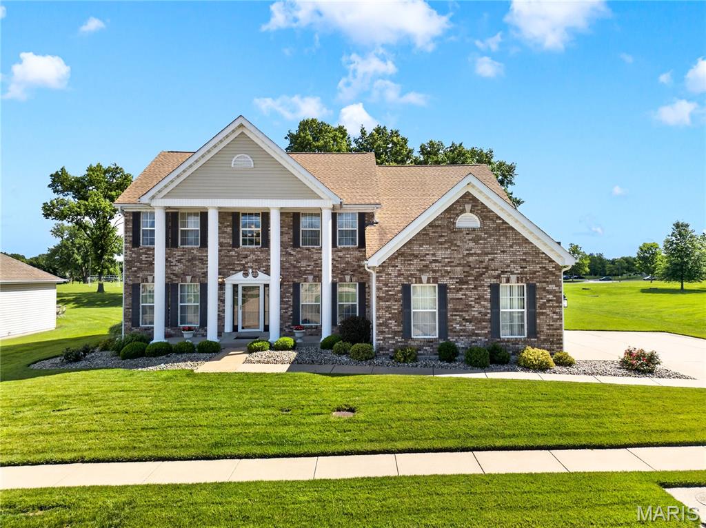 Welcome to this beautifully maintained 4-bedroom, 2-story traditional home in Portland Grove, a McBride luxury community built in 2001. This original-owner residence sits on a level 0.51-acre lot with a stately front elevation and a lush, carpet-like lawn, supported by front and rear inground sprinklers.
The inviting tile entry opens to spacious living areas, including a open warm family room with gas fireplace and a bright sunroom/hearth room that expands the main-level living space. The kitchen features your family chef's delight, starting with solid-surface counters (quartz 2026), custom cabinetry, stainless built-in appliances, breakfast bar, pantry, and seamless flow between the family room the hearth room and a spacious patio—perfect for everyday living and entertaining.  You will love the T-staircase leading to the upper level with a dramatic catwalk. The luxury primary suite includes a walk-in closets and a spa-inspired bath with a stand-alone soaking tub, separate shower, separate vanities, and updated fixtures. The hall bath is also completely updated, and the main-floor powder room has also been beautifully refreshed.  The finished lower level offers a game room (pool table is negotiable) and the lower level den is ideal for recreation, hobbies, theater or home gym. Major updates include• Zoned heating & cooling (2021)• Upgraded attic insulation (2021) • Maple hardwood flooring (2021)• 50-gal water heater (2024)• 5-burner radiant electric cooktop (2025) • Sump pump (2025) • Quartz counters (2026).   Additional features: 3-car garage, main-floor laundry, and a level backyard perfect for outdoor enjoyment.  A rare opportunity to own this well-cared-for home in one of Florissant’s most desirable luxury communities.  HSA Home Warranty provides peace of mind for both the seller and buyer! Don't wait This home is gorgeous!