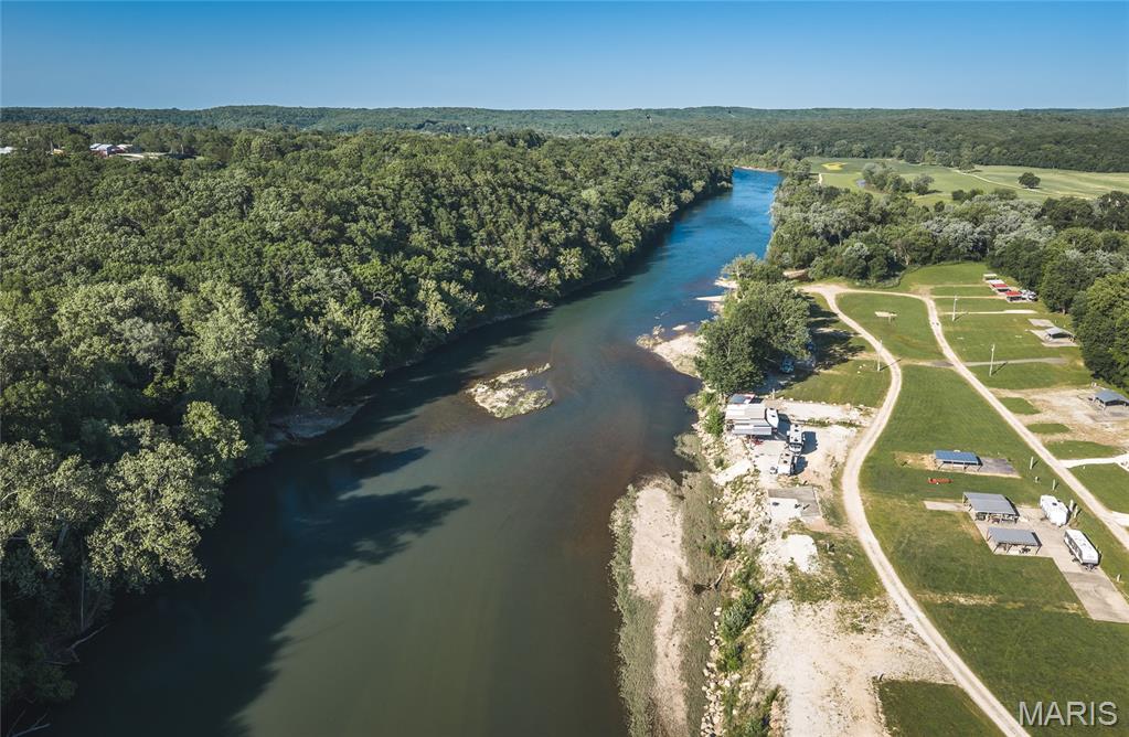 Discover the perfect escape near the scenic Gasconade River with this ready-to-enjoy river lot offering the ideal setup for outdoor adventures, relaxing weekends, and unforgettable memories. Whether you’ve been dreaming of a peaceful camping retreat, a place to park your RV, or a future recreational getaway, this property provides the perfect blend of convenience and nature. Located inside a gated community, this property offers added privacy and peace of mind while still giving you easy access to everything the river lifestyle has to offer. Owners also enjoy access to a private concrete community boat ramp, making it simple to launch your boat, kayak, or canoe and spend the day exploring the beautiful Gasconade River. With water, sewer, and electric already in place, you can spend less time preparing and more time enjoying your surroundings. Picture mornings with coffee by the campsite, afternoons spent fishing or floating the river, and evenings gathered around a campfire under the stars with family and friends. The Gasconade River area is known for its scenic beauty, outdoor recreation, and relaxed atmosphere, making this property an excellent choice for weekend getaways, seasonal use, or future investment potential. Whether you’re seeking a quiet retreat or an adventure-filled escape, this property is ready for your vision. River lots with utilities, gated access, and private boat ramp privileges are hard to find—schedule your private showing today and start enjoying the river lifestyle you’ve been waiting for!