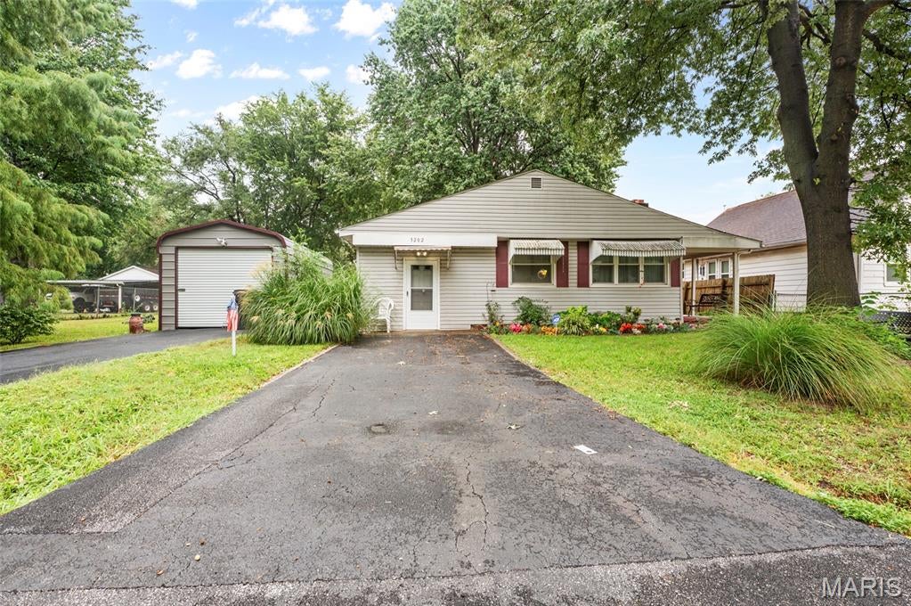 This affordable three-bedroom ranch home offers convenient one-level living.  A covered front porch welcomes you into the living room, which flows into the eat-in kitchen. The bathroom has a walk-in shower, and the bonus room can serve a variety of needs and uses. The sale includes a second parcel, that provides a spacious yard with ample room to enjoy the outdoors. A detached garage offers covered parking. The property is being sold AS-IS, with all personal property and items currently in the home included in the sale. Buyers and buyers' agents are responsible for verifying all information. Schedule your showing today!