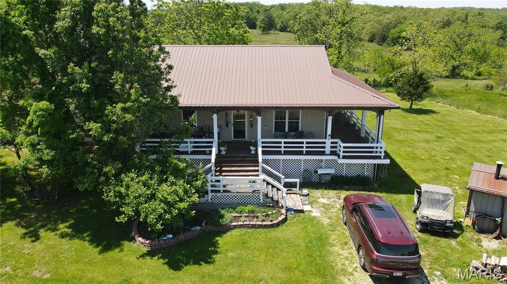 269 acres m/l with highway frontage on H Hwy, Salem, MO – located on Dry Creek. Beautiful working farm with an excellent combination of pasture, hay ground, and timber. Approximately half wooded and half pasture/hay ground. Nine grazing paddocks with well water available to each paddock. Well and two septic tanks. Pasture over seeded with both summer (Lespedeza, red clover, Indian grass, and Bermuda grass) and winter (Fescue grass orchard grass, clover, and red clover grass). Buildings include a 30X50 hay barn, 50X50 grain storage, tack room, implement shed, 30X40 modern shop and lots of storage space. Spacious home features 3 bedrooms, 2 ½ baths, game room, (Don’t miss this modern kitchen with moveable island on rollers, sink tilt-tray, built-in book case for cookbooks, custom hickory cabinets, walk-in pantry with pullout drawers, bread box, toe kick drawers, kitchen desk), dining room, living room, den, study, and much more. If that isn't enough, enjoy the 8-foot wrap around porch with a view of the whole farm. This well-maintained farm offers an excellent combination of woods and pasture/hay ground, making it ideal for cattle, hay production, recreation, or country living at its finest. This new home was built in 2011 and added to the original home. Nice to know that the farm is located along the White River Trace Wagon Trail.
