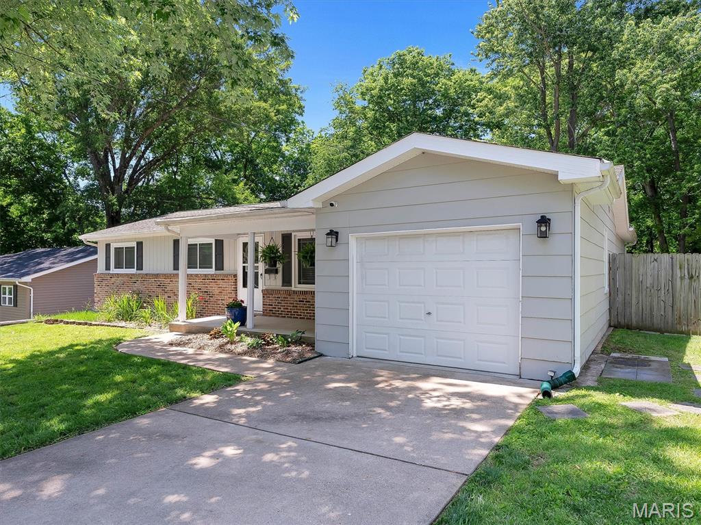 The updates are real. The care is obvious. And the home is ready! This seller has owned and maintained this property for years, upgrading it thoughtfully over time, and the result is a home that is meticulously clean from top to bottom, move-in ready without question, and loaded with improvements that a buyer will appreciate from the moment they walk through the door.

Three bedrooms. Two Baths with a bonus half bath in the basement. A full kitchen remodel. A full primary en-suite bath remodel. A screened porch you will never want to leave. And a seller who treated this home like it deserved to be treated.

Step inside, and hardwood floors and crown molding set the tone across the main level. The living room is warm and spacious, flowing directly into a kitchen/dining/bar area. Ceiling-height white shaker cabinets wrap both walls. The backsplash is a sharp gray subway tile. Stainless appliances throughout, including a French-door refrigerator, dishwasher, built-in microwave, & range/oven.  This kitchen is current, functional, and built to last.

The primary suite earns its name. It is an oversized room with carpet, a ceiling fan, a wall-mounted mini-split for personal climate control, and a sliding glass door leading to the screened porch. The en suite bath is fully remodeled, featuring a pocket-door entry.  Gorgeous double-sink vanity with white solid countertops, modern brushed nickel hardware, recessed lighting, and a walk-in glass block shower with full-height textured onyx surround, a pebble stone accent band, a recessed niche, and a curved rain-head fixture. The kind of bathroom that gets noticed. 

The screened-in covered deck is one of the signature features of this home. Enclosed, with dual ceiling fans overhead and ample square footage for a complete furniture arrangement, it functions as a genuine extra room from early spring through late fall. A sliding door off the kitchen and the primary suite door both connect to this space, making it central to how the home lives. Additional outside stained wood deck space and steps down to a concrete patio below, backed by a fully fenced yard with mature tree canopy and raised brick garden beds on both sides. This is a private, usable outdoor space.

The two additional bedrooms on the main level are solid, comfortable rooms with carpet, ceiling fans, and good closet space.  The full hall bath serves these rooms well, with a custom wood vanity, tile floors, a tile accent backsplash, and a window that keeps the space bright and well-ventilated.

The full basement adds significant square footage and flexibility. Partially finished, with drywalled walls, wood trim, and crown molding throughout, it is clean and ready to use. The open area is large enough for a rec room, home gym, or entertainment space. A separate framed room serves well as a home office or additional storage. A half bath is already in place, finished with a clean white vanity and tile floor. A walkout sliding door provides direct access to the backyard, making the basement feel connected to the rest of the home rather than tucked away.

All walls/ceilings on main floor and exterior siding have been recently professionally painted, 2-year old water heater, meticulously maintained... don't miss out on this one!  One-car garage. Fenced yard. SEE IT TODAY!