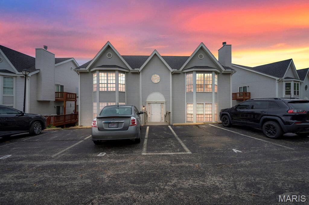 Back on the market! No fault of the seller. Step into this breathtaking condominium nestled within the desirable Spring Hill Farm Community. The second-floor unit showcases an open floor plan, highlighted by vaulted ceilings and a cozy gas fireplace. The open kitchen is equipped with stainless steel appliances, custom cabinetry, and granite countertops. The refrigerator remains with the property. Recent improvements comprise the LG washer and dryer, dishwasher, and garage door opener, all installed in 2022. The primary suite serves as a peaceful sanctuary, featuring a double-bowl vanity, walk-in shower, custom closet organizer, and ample natural light. Further interior highlights include updated lighting fixtures, fresh paint, and luxury vinyl plank flooring throughout. As an end unit, it offers a one-car garage, private storage, and one assigned parking space. The building is secured and locked at all times, with the community offering amenities such as a clubhouse and swimming pool. The HOA fee includes insurance, sewer, water, trash, snow removal, and exterior maintenance.