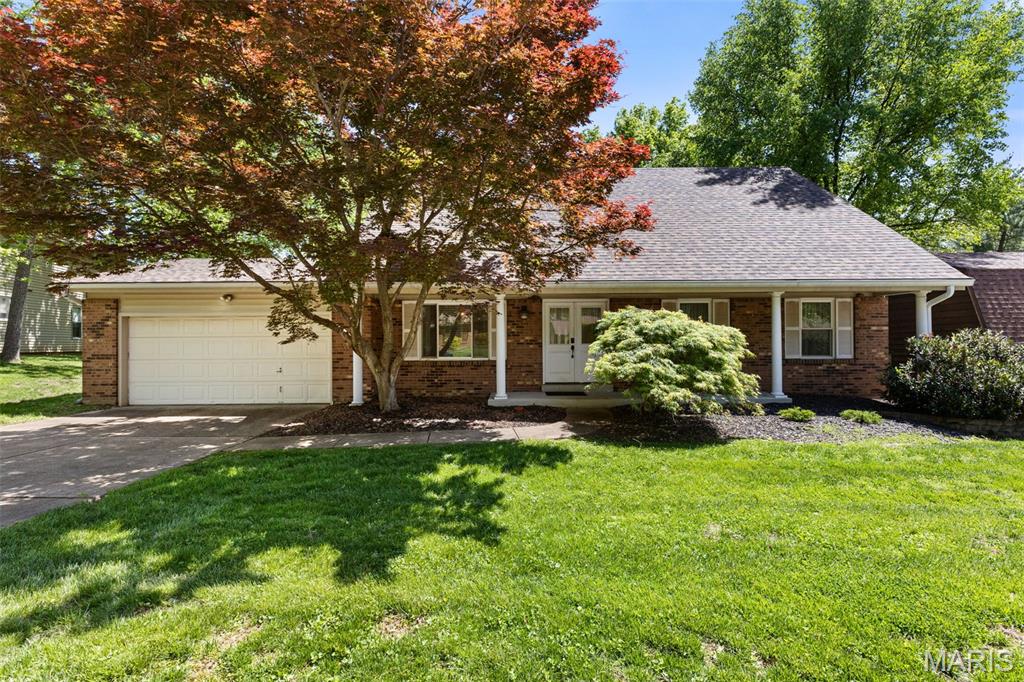 Beautifully updated and move-in-ready, this home offers a charming blend of style and functionality in a central and desirable part of Chesterfield, close to highways and Parkway Schools. Featuring 4 bedrooms and 2.5 baths, the home includes a sought-after main-floor primary suite with convenient main-floor laundry. With nearly 2,000 square feet of inviting living space, plus a professionally finished lower level adding approximately 900 additional square feet, there’s plenty of room to relax, entertain, or unwind. The kitchen is thoughtfully designed with custom wood cabinetry, granite countertops, a gas cooktop and oven, ceramic tile flooring, and views of the backyard. The great room features soaring ceilings open to the second floor and a cozy wood-burning stone fireplace, complemented by beadboard detailing along the walls, creating a warm and welcoming gathering space. Upstairs, three generously sized bedrooms feature newer carpet (2022) and are complemented by a versatile bonus loft—ideal for a reading nook, homework station, or home office. Major updates include a new roof (2025), offering added value and long-term peace of mind. Step outside to enjoy a private backyard backing to a wooded area, creating a peaceful setting, complete with a patio and firepit—perfect for relaxing or entertaining. This home offers flexible living space and everyday comfort in a great Chesterfield location.