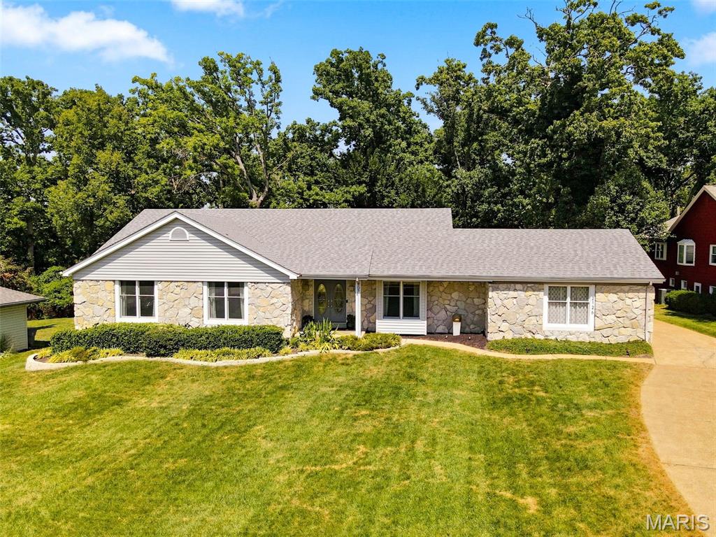 Welcome to 2126 Park Forest Drive! This spacious 4-bedroom, 2.5-bath ranch offers 2,693 sq. ft. of main-level living, an impressive floor plan and an expansive, private fenced backyard. Step inside to a welcoming foyer flanked by a formal dining room featuring a charming window seat and a versatile office/sitting room. Beautiful hardwood flooring flows throughout the home, creating a warm and cohesive feel. The heart of the home is the beautifully remodeled kitchen and adjoining breakfast room, featuring a vaulted ceiling, custom cabinetry, granite countertops, tile backsplash, stainless steel appliances, hardwood floors, large walk-in pantry and bay window that fills the space with natural light. The adjoining great room makes a statement with its wood-beamed vaulted ceiling, gas fireplace and hardwood flooring. Multiple access points create a seamless connection to the outdoor living space, with doors from the kitchen/breakfast room, great room and primary bedroom leading directly to the composite deck. Retreat to the impressive primary suite featuring hardwood floors, a private sitting area and direct deck access. A generously sized custom walk-in closet provides exceptional storage, while the renovated spa-like ensuite creates a relaxing retreat with beautifully updated finishes. All 2.5 baths have been renovated. An oversized main-level laundry room adds everyday convenience and generous storage. The full unfinished walkout lower level offers tremendous potential for future living, recreation and entertainment. Outside, enjoy the expansive composite deck with pergola creating an inviting space for outdoor dining and relaxation, along with a patio overlooking the private, fully fenced backyard an ideal setting for entertaining, gardening, pets or simply relaxing outdoors. A wonderful combination of generous ranch-style living, thoughtful updates, exceptional outdoor space in the heart of Chesterfield!