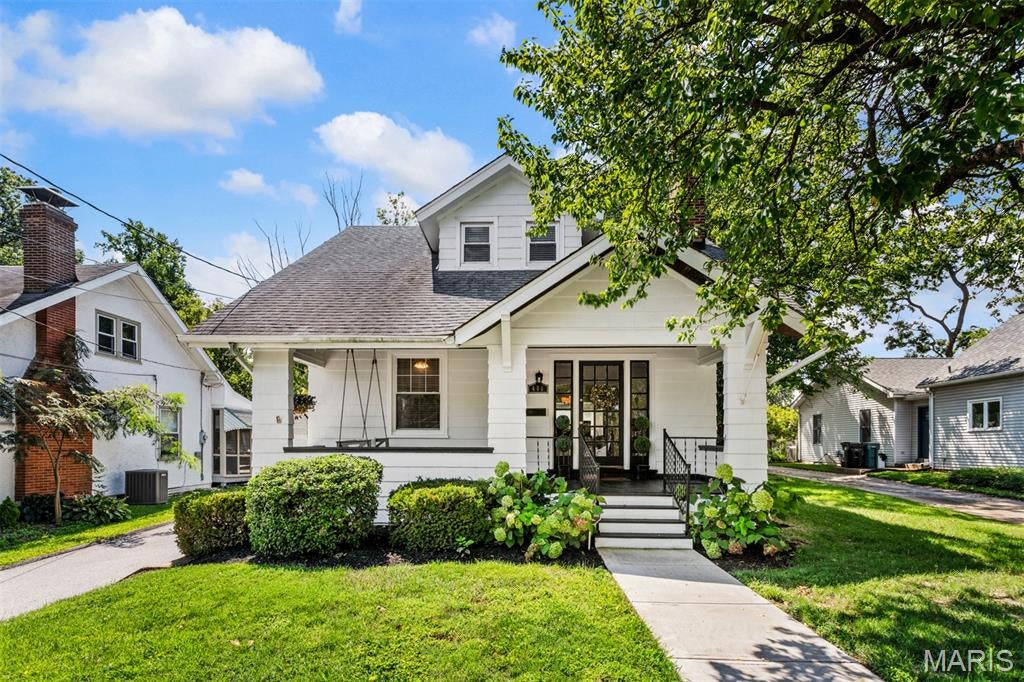 Welcome home to 400 E Adams Avenue! This exquisite 3-bedroom, 2-bathroom Craftsman style home perfectly blends classic charm with modern updates, situated just blocks from vibrant downtown Kirkwood. A welcoming front porch offers the perfect spot to greet guests or unwind. Inside, the bright, open living space features beautiful wood floors and a cozy gas fireplace. The seamless flow leads from the dining room into a main-floor family room and a bright kitchen equipped with a breakfast nook. Step into the sunroom, which opens to a private patio and an expansive rear yard—your own peaceful retreat for entertaining. The main floor also includes a large bedroom and an updated full bath, while the second floor boasts a versatile sitting room, two spacious bedrooms, and generous closet space. Complete with extra parking and a two-car garage, this Kirkwood gem is ready for its next chapter.  This is a great home!