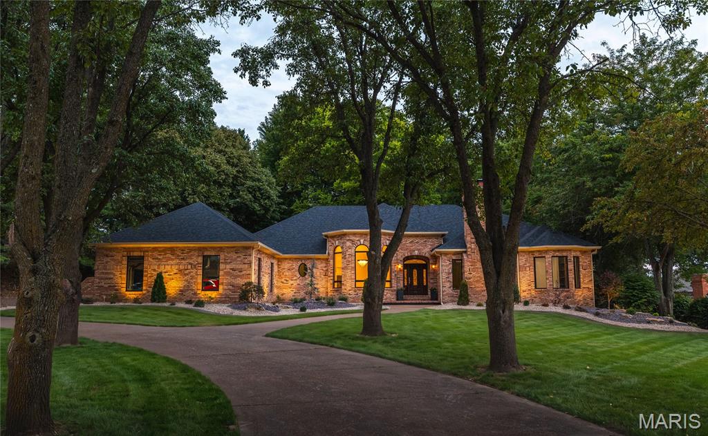 42 Country Club Drive in Edwardsville Illinois is a recently renovated timeless estate positioned perfectly for lifestyle living in one of the Metro East’s most thriving  communities.  Minutes away from multiple Interstate access points the residence is highly connected to the entire Metro St. Louis region. The 4,700 plus square ft home features 4 bedrooms, 3 full, and 2 half baths. Walk out lower level with an additional lower level access from the oversized 3 car garage.  Finished lower level is perfect for entertaining and includes additional private guest quarters.  Ample storage with future potential for additional finished space. Minutes from Southern Illinois University at Edwardsville and Sunset Hills Country Club.