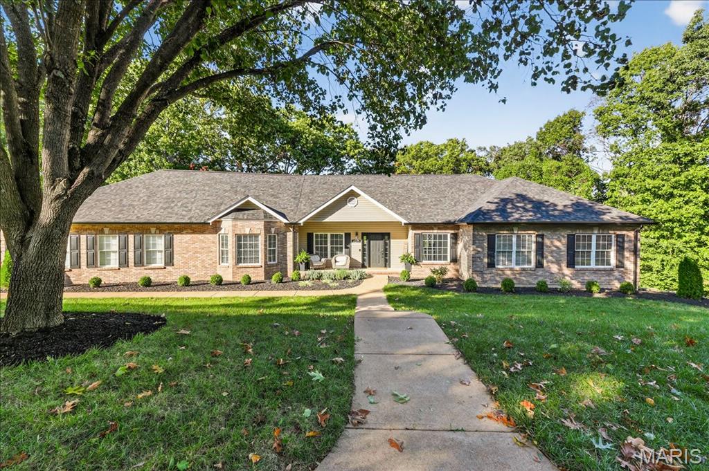 If you’ve been dreaming of space, privacy, and a home that feels like your own retreat this is it. Perfectly positioned on five scenic acres near the end of a quiet cul-de-sac, this remarkable property offers the best of both worlds: peaceful, wooded surroundings and the convenience of being just minutes from town. Step inside and discover a home where timeless design meets modern comfort. The heart of the home is a stunning great room with gleaming hardwood floors, coffered ceiling, crown molding, and a wood accent wall that adds warmth and character. The gourmet kitchen blends function and style with custom cabinetry, granite counters, stainless appliances, a large eat in island, and under cabinet lighting. The adjoining family room features vaulted ceilings, a cozy wood burning fireplace, and access to a brand-new deck ideal for effortless indoor outdoor living. The primary suite is a peaceful retreat with hardwood floors, a walk-in closet, and a spa inspired bath featuring dual vanities, soaking tub, and walk-in shower. Two well appointed bedrooms are spacious and thoughtfully updated. The finished lower level expands the living space with a large recreation room, full wet bar, bonus room, and two additional bedrooms with new carpet and lighting perfect for guests or entertaining. Two expansive decks overlook the tree lined property, offering tranquil spaces to relax, entertain, or simply enjoy the changing seasons. With beautiful updates throughout, a new roof and fresh modern finishes, this is the private retreat you’ve been waiting for, don’t miss out!